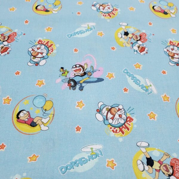 Baumwolldruck Popeline Lizenz Doraemon mit Flugzeugen auf hellblau